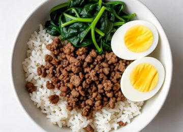 Healthy Meal Prep Bowls Featuring Rice, Meat, Spinach, and Eggs