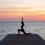 Mastering Low Lunge Pose During Golden Hour Oceanfront Yoga Practice