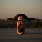 Practicing Advanced Arm Balance Yoga Poses During the Golden Hour