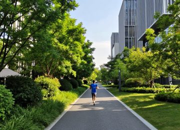 Urban Jogging on Paved Paths with Green Foliage and Buildings